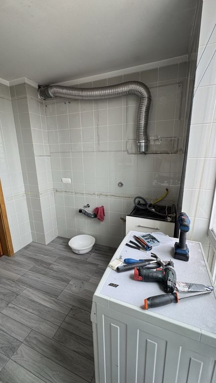 Old kitchen removal during renovation in Porto
