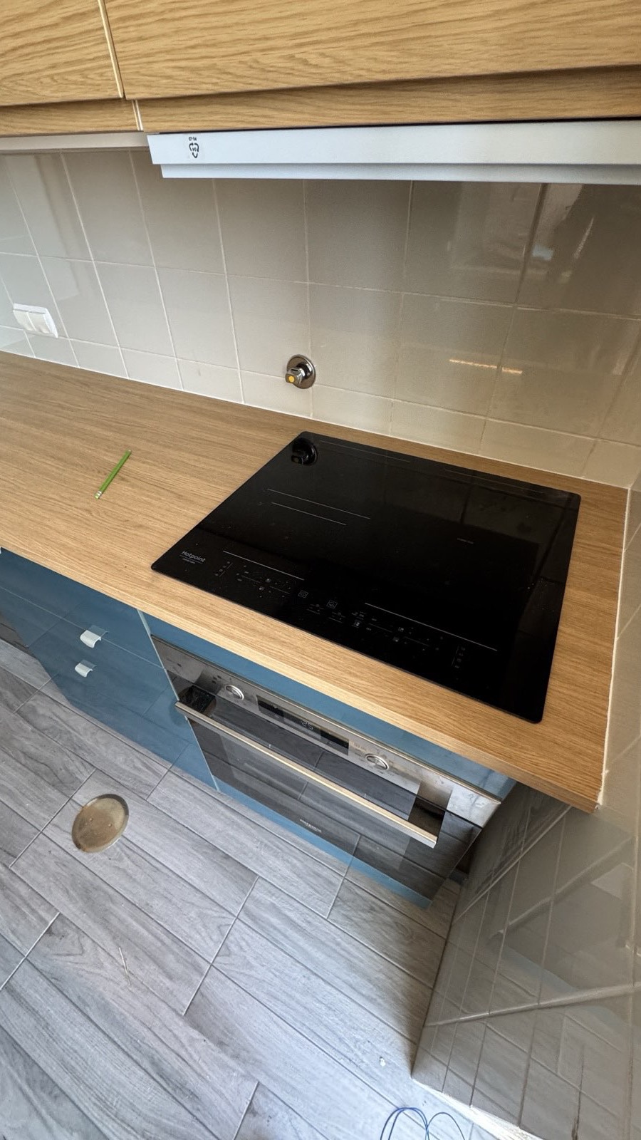 Induction hob and oven installed in IKEA kitchen
