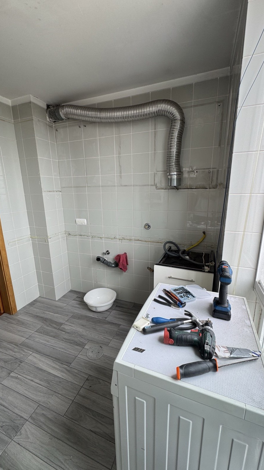 Old kitchen removal during renovation in Porto